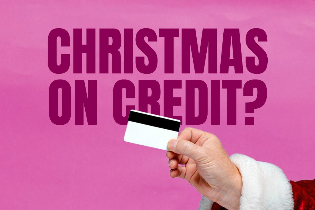 Santa's hand holding a credit card