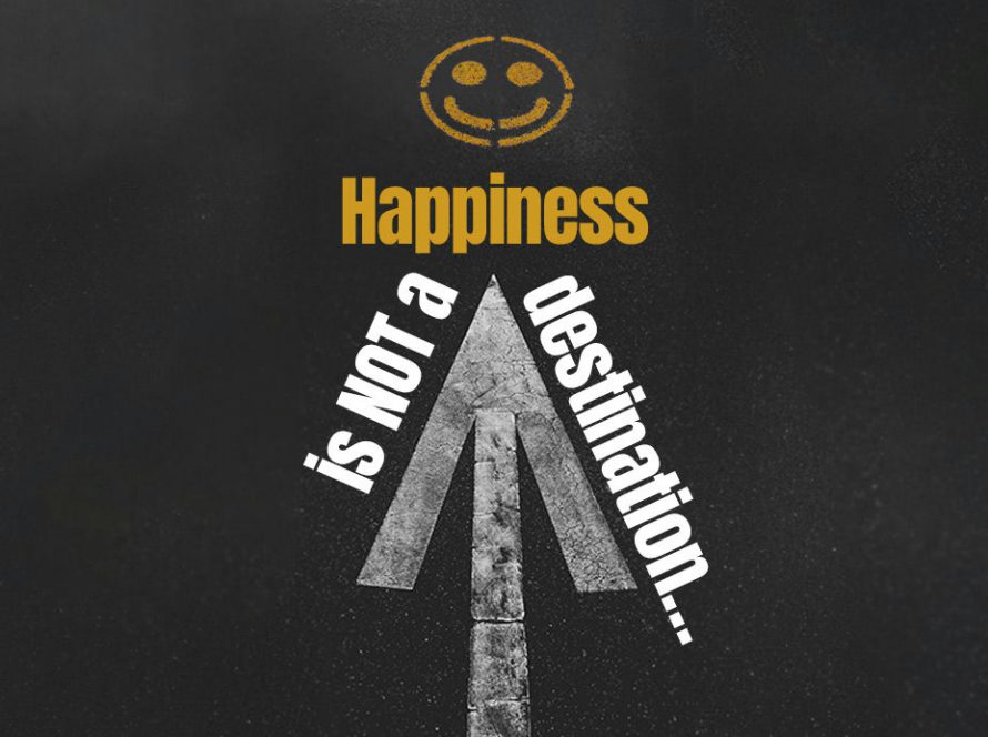 Words 'Happiness is not a destination' written on a road in paint
